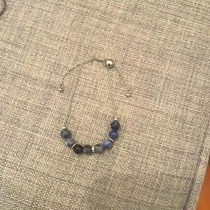 silver bracelet with blue spheres